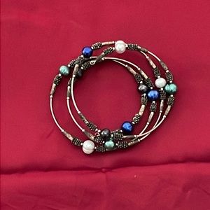 Multi colored beaded metal bracelet perfect for any outfit!